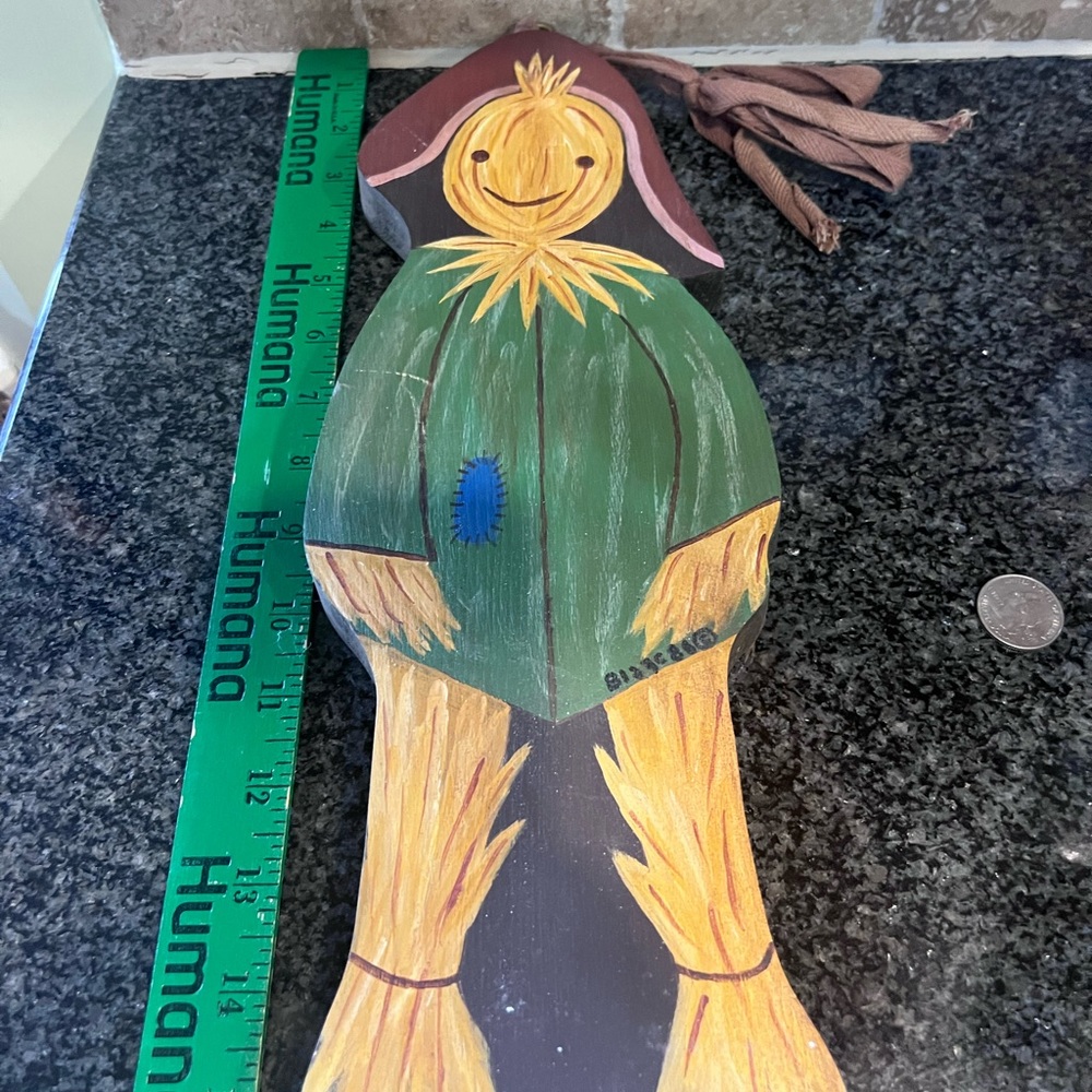 Fall/Autumn wooden decoration of a scarecrow. Can be hung.